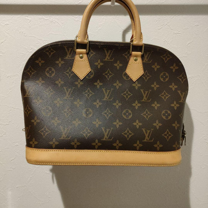 Louis Vuitton Alma Monogram Handbag Leather