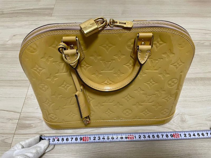 Louis Vuitton Alma Pm Handbag Vernis Citrine Leather