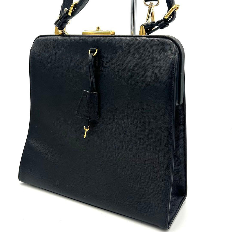 Prada Saffiano Top Handle Bag Key Lock Black Leather Gold Hardware