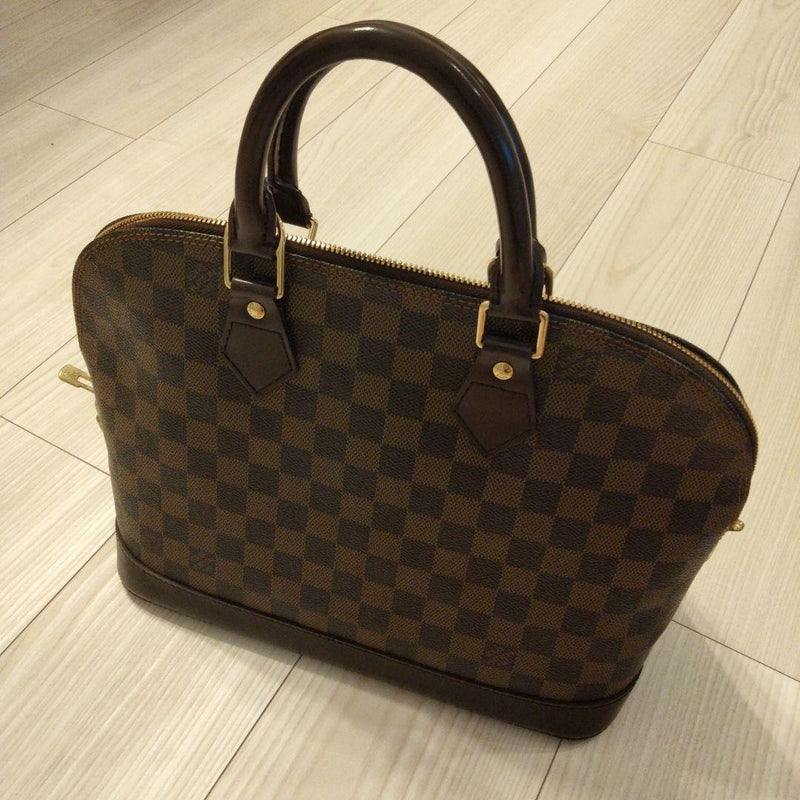 Louis Vuitton Alma Handbag Leather
