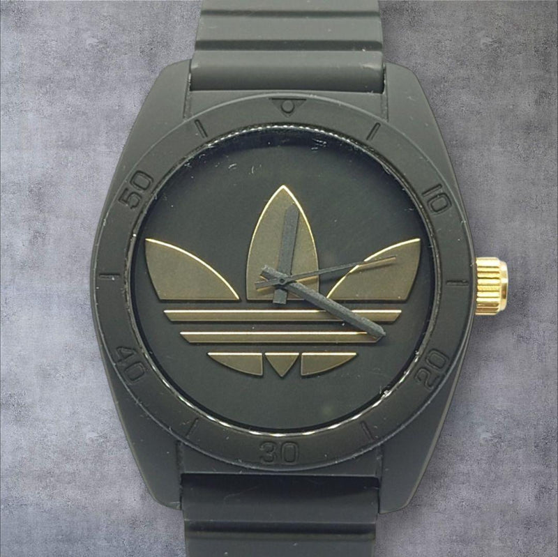 Adidas Trefoil Big Logo Wristwatch Black Dial Gold Accents Silicone Band