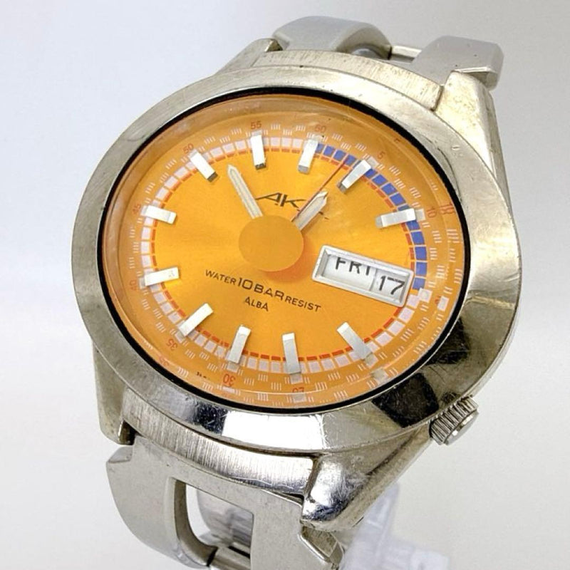 Seiko Alba AKA V733-5A10 Quartz Watch 40mm Orange Dial Day Date 10BAR Water