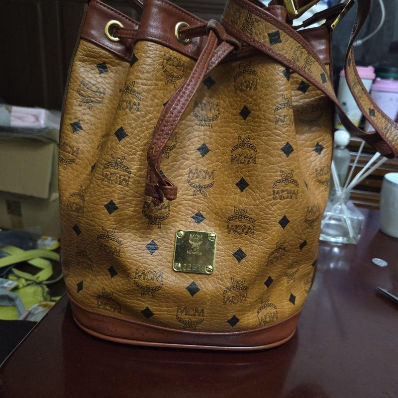 MCM Z2515 Monogram Bucket Drawstring Shoulder Bag Cognac Brown Gold Hardware