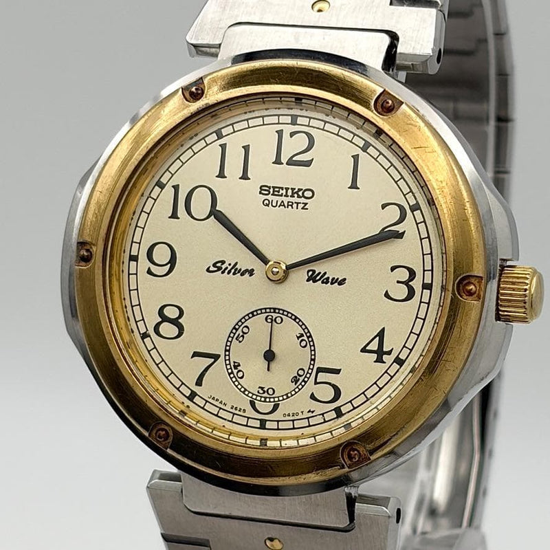Seiko Silver Wave 2628-0110 Quartz 37mm SS SGP Bezel Champagne Dial Small