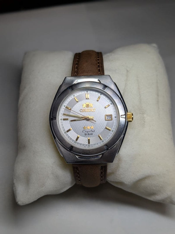 ORIENT Three Star Crystal Quartz Men Silver Dial Gold Index Brown Leather SS