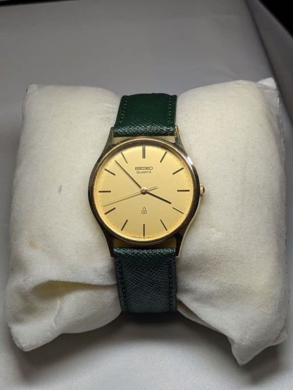 SEIKO 2621-0550 Quartz Wristwatch Gold Dial Deep Green Strap Round Case