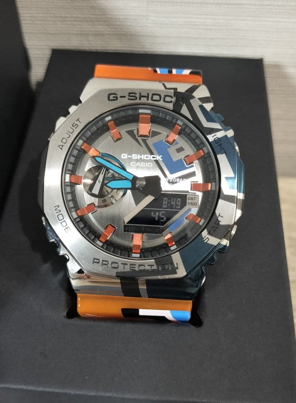 G-SHOCK GM-2100SS-1AJR Analog-Digital Metal Covered Orange Rubber Graffiti Watch