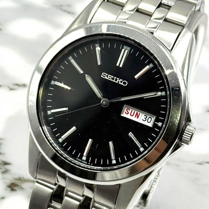 SEIKO 7N43-0AM0 Spirit Men Quartz Movement Silver Tone Black Dial DayDate Watch