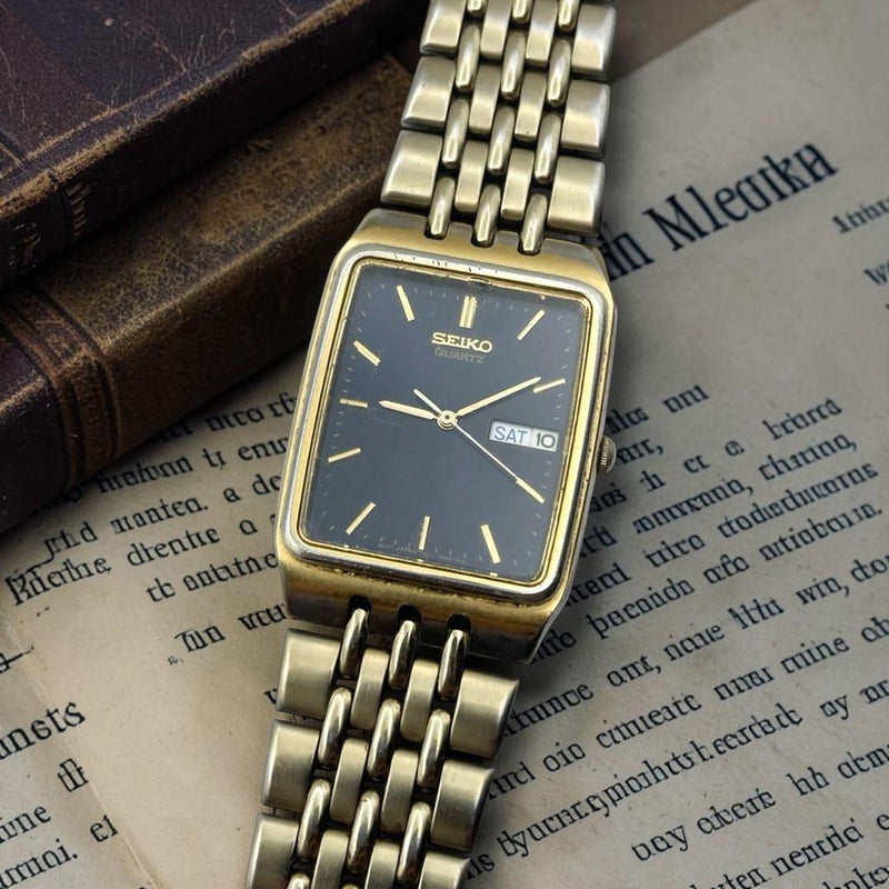 Seiko Quartz Rectangular Watch 30x26mm Black Dial Gold Day Date WR Metal