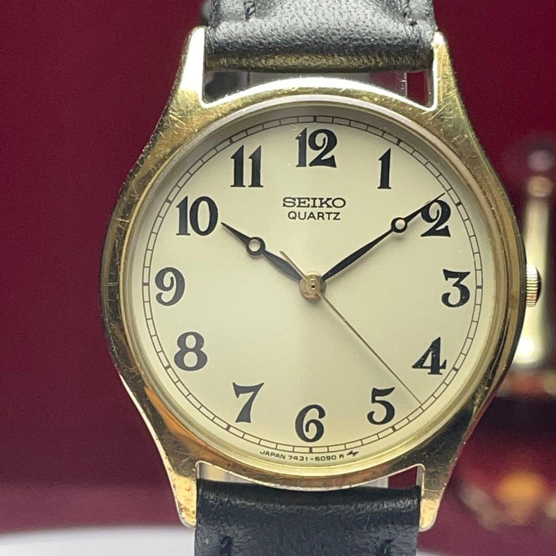 SEIKO 7431-6080 Quartz Watch 32mm Gold Tone SS Ivory Dial Black Leather 1994