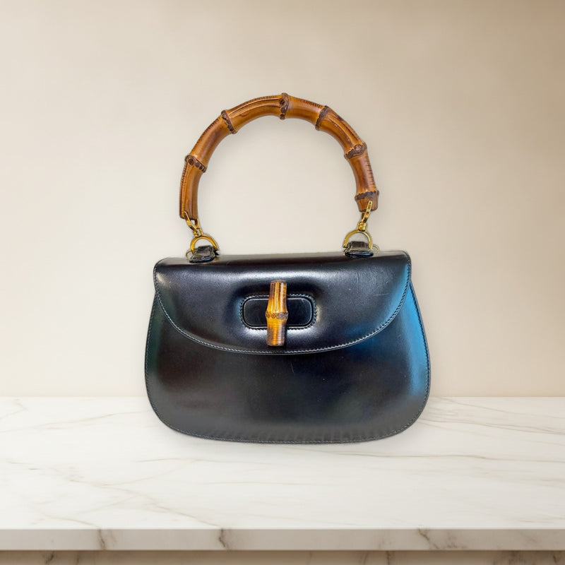 Gucci Old Gucci Bamboo Turn Lock Handbag Black Leather Red Interior