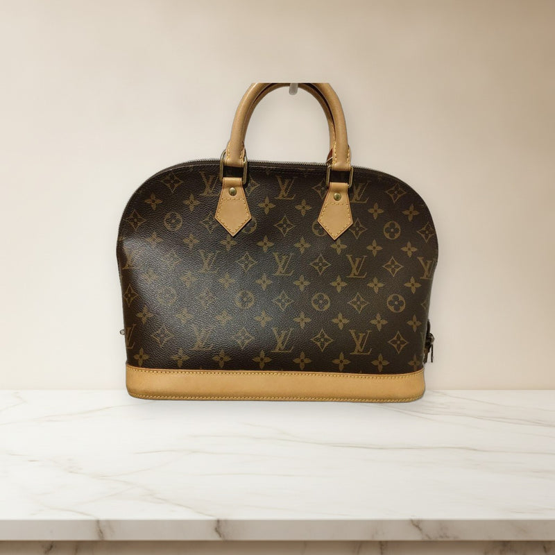 Louis Vuitton Alma Monogram Handbag Leather