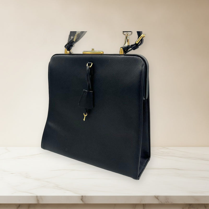 Prada Saffiano Top Handle Bag Key Lock Black Leather Gold Hardware