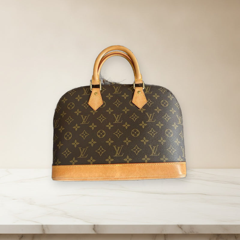 Louis Vuitton Alma Monogram Handbag Leather