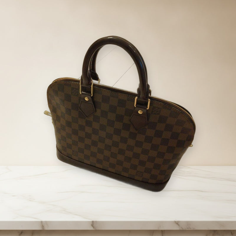 Louis Vuitton Alma Handbag Leather